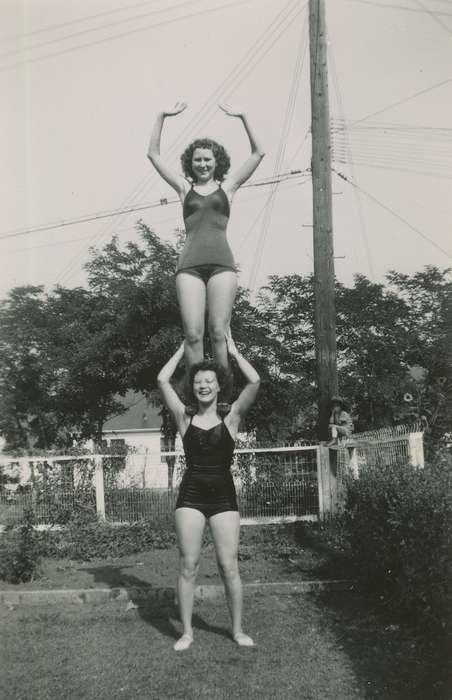 Portraits - Group, backyard, USA, Iowa, curly hair, bush, Wilson, Dorothy, bathing suit, Leisure, acrobats, telephone pole, Homes, acrobatic, fence, history of Iowa, Iowa History