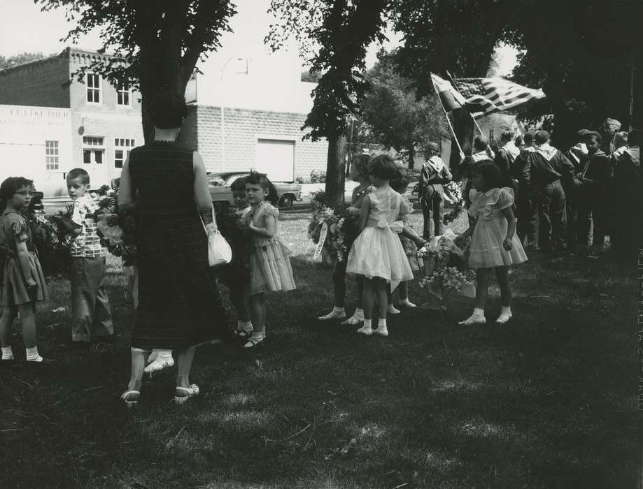 Children, girl, boy, purse, history of Iowa, cub scout, Waverly Public Library, flower, Iowa, Civic Engagement, wreath, american flag, dress clothes, Iowa History, dress shoes, cap