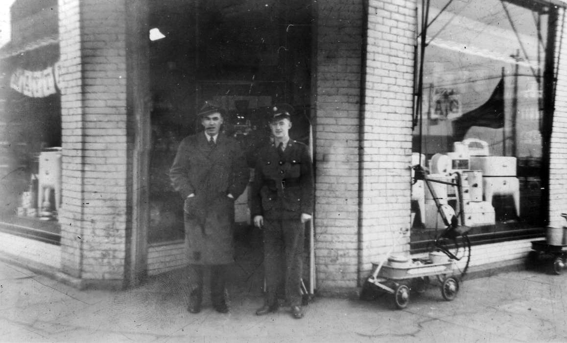 Iowa, Ottumwa, IA, storefront, Businesses and Factories, police officer, advertisement, store, hardware store, Lemberger, LeAnn, Cities and Towns, Labor and Occupations, history of Iowa, Main Streets & Town Squares, Iowa History, wagon