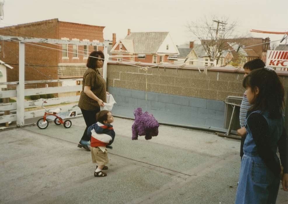 Cities and Towns, tricycle, Iowa History, Families, People of Color, Holidays, history of Iowa, Dubuque, IA, Iowa, Children, pinata, Valenti, Providence