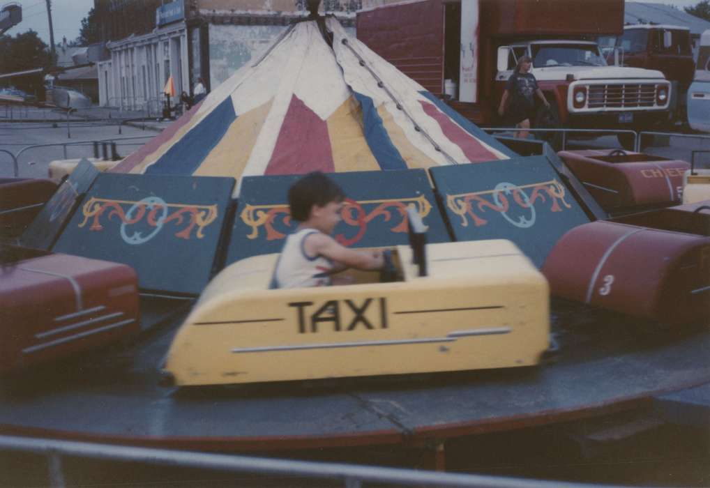 spinning, taxi, history of Iowa, Iowa History, Motorized Vehicles, Fairs and Festivals, Adam, Andrew, carnival, Iowa, boy, Birmingham, IA, Children, rides