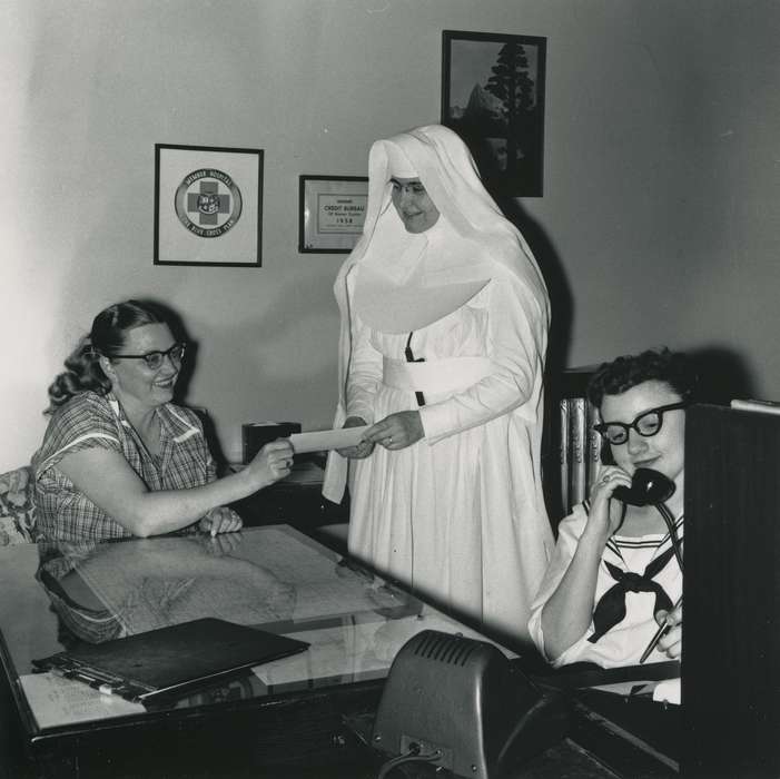 history of Iowa, Portraits - Group, Waverly Public Library, Waverly, IA, photo frame, Iowa, correct date needed, desk, Iowa History, glasses, women, Hospitals, medical chart, nun, Labor and Occupations