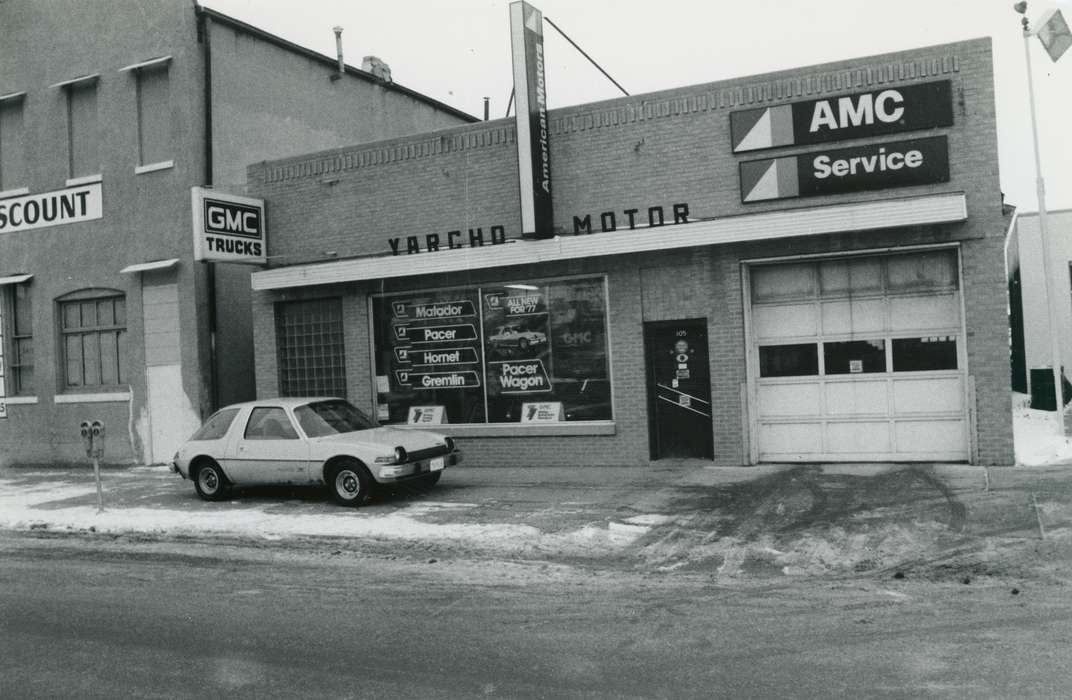 Main Streets & Town Squares, mechanic shop, parking meter, Iowa History, history of Iowa, garage door, Motorized Vehicles, Businesses and Factories, brick building, car, sidewalk, Iowa, Cities and Towns, snow, Waverly Public Library