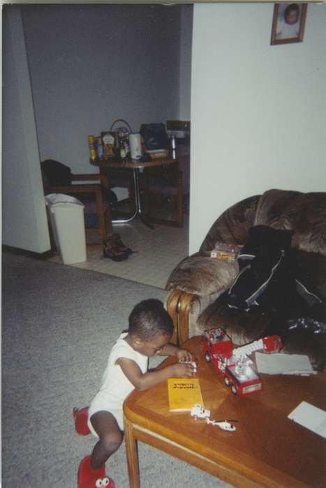 Iowa, elmo, Waterloo, IA, toy, Lewis, Marsha, Leisure, Children, living room, african american, Homes, People of Color, playing, history of Iowa, fire truck, Iowa History