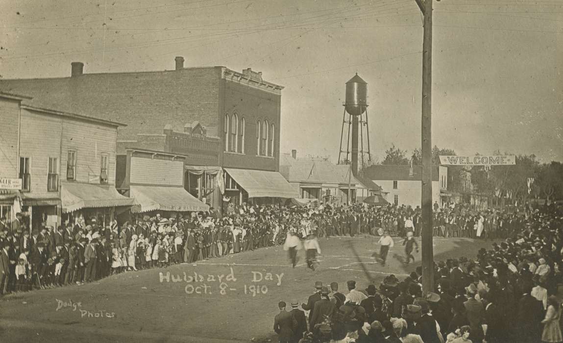 Main Streets & Town Squares, history of Iowa, Iowa History, Cook, Mavis, game, veranda, storefront, crowd, Fairs and Festivals, water tower, Iowa, Cities and Towns, sign, Hubbard, IA