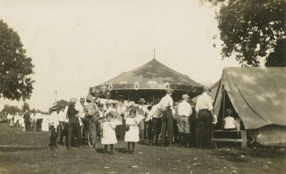 Iowa, parasol, Fairs and Festivals, Leisure, Children, carousel, Entertainment, umbrella, West Liberty, IA, balloons, Meyers, Peggy, history of Iowa, marry go round, Iowa History