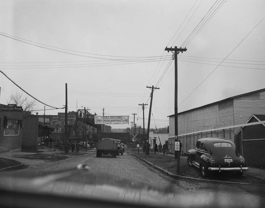 banner, train, Ottumwa, IA, Iowa, meat packing plant, telephone pole, car, Lemberger, LeAnn, Businesses and Factories, history of Iowa, strike, Motorized Vehicles, Iowa History