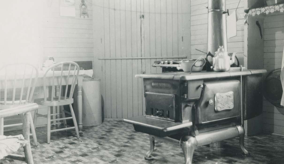 wood stove, history of Iowa, kitchen, dining table, Iowa History, Waverly, IA, stove, coffee pot, wooden chair, Iowa, Homes, correct date needed, Waverly Public Library