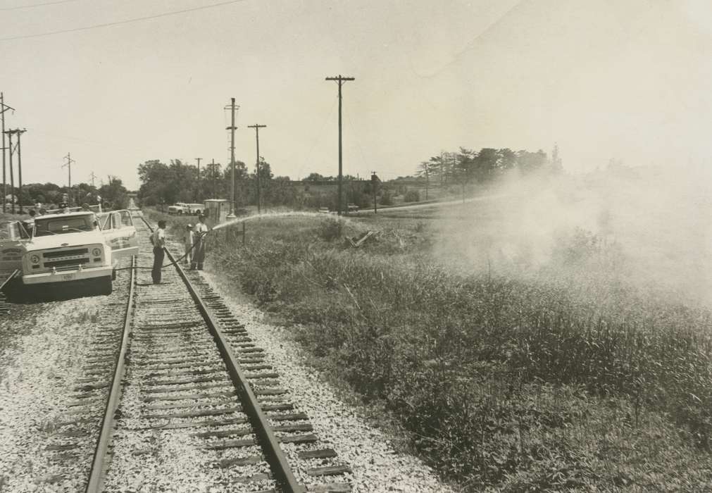 telephone poles, history of Iowa, Iowa History, truck, Wrecks, railroad track, fire, Waverly, IA, fireman, Iowa, Waverly Public Library, Labor and Occupations