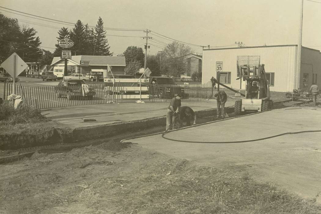 Labor and Occupations, hole, railroad track, car, Waverly Public Library, Iowa History, Waverly, IA, gas station, Businesses and Factories, forklift, history of Iowa, Iowa, Motorized Vehicles, gas pump, Main Streets & Town Squares, fence, truck, construction crew