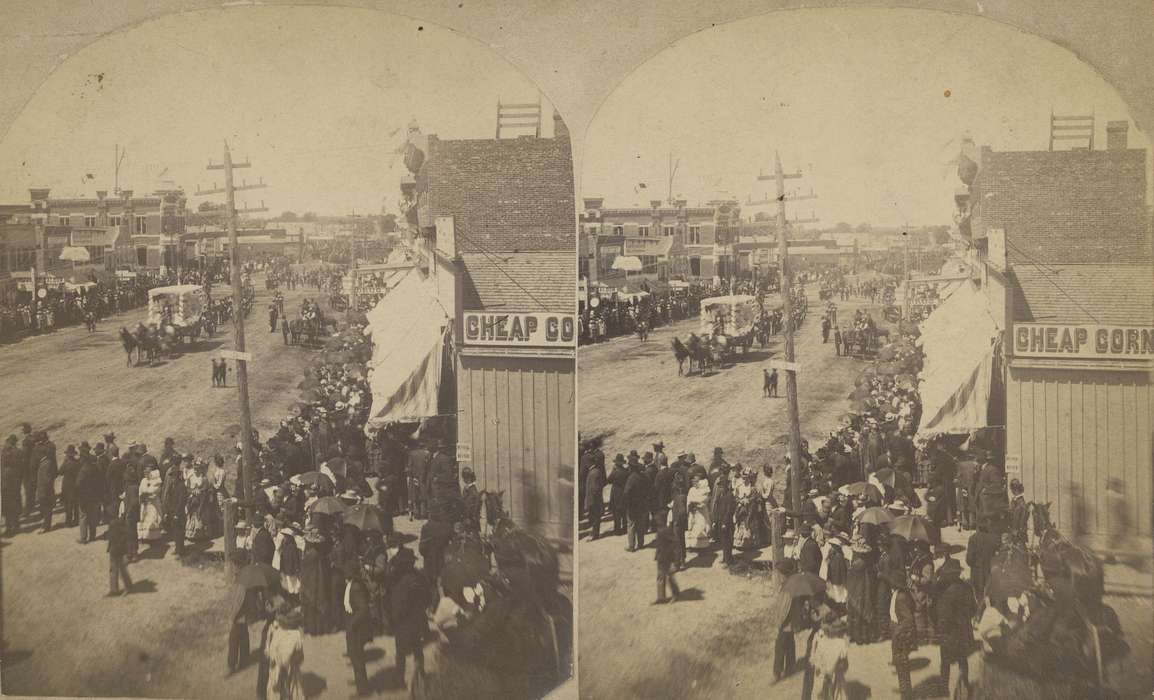 telephone pole, suits, horse and buggy, e. bremer ave., dentist, saloon, Waverly Public Library, Main Streets & Town Squares, history of Iowa, Iowa History, Entertainment, brick building, crowds, Waverly, IA, horse and cart, parade float, Iowa, drugstore, bank