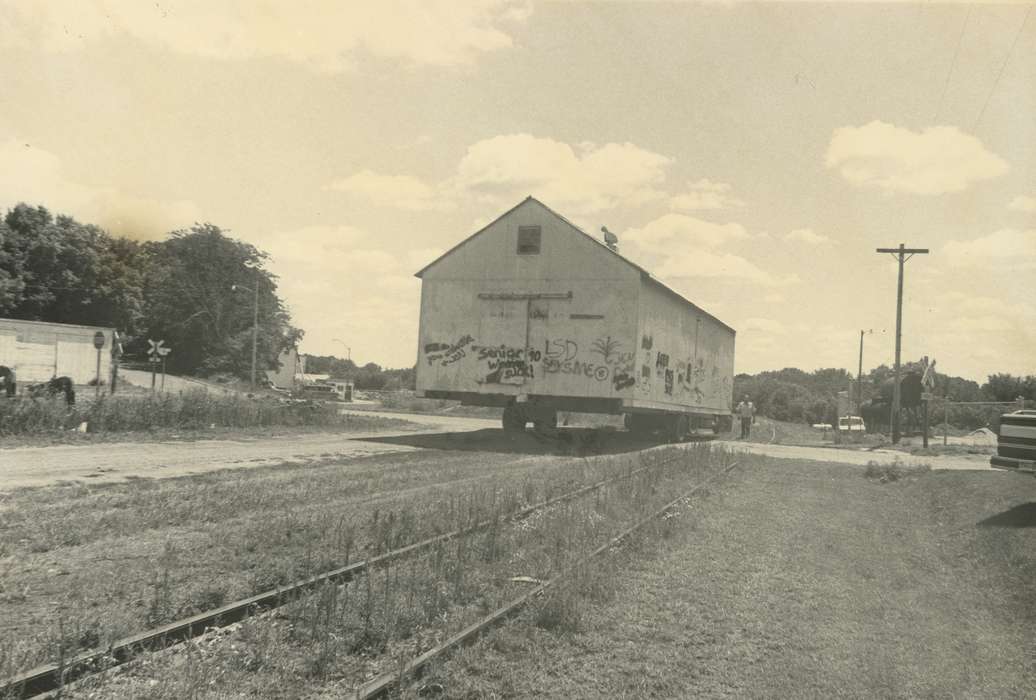 train tracks, history of Iowa, Iowa History, IA, Motorized Vehicles, electric lines, grass, man, Iowa, correct date needed, tree, sign, Waverly Public Library