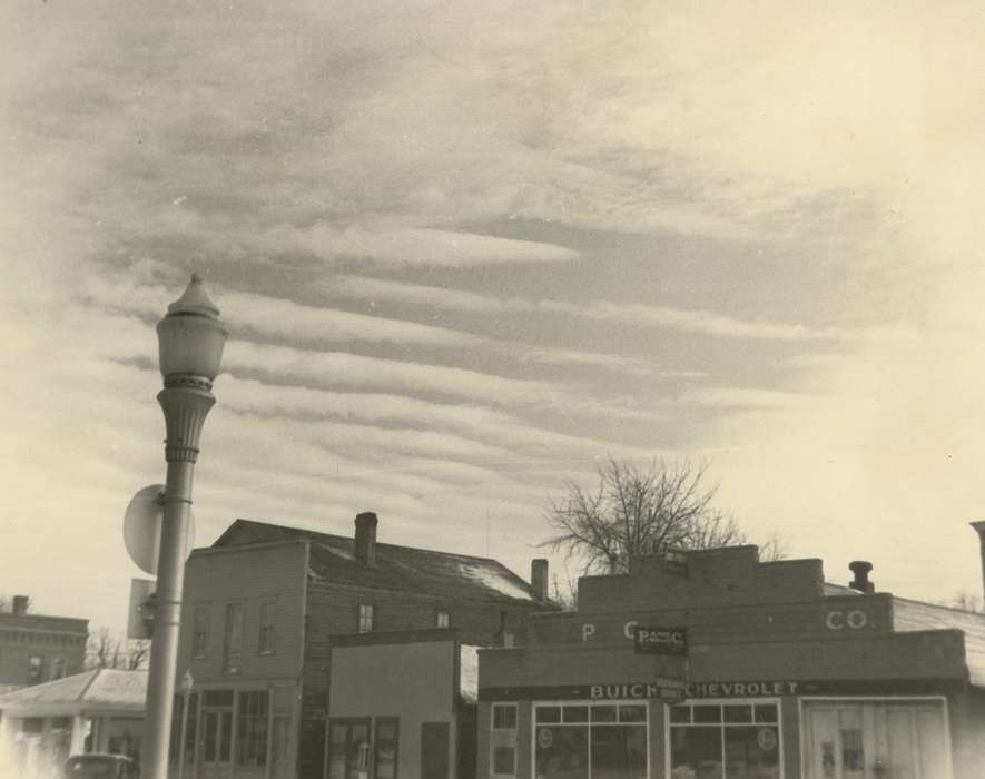 Main Streets & Town Squares, Waverly Public Library, history of Iowa, Iowa History, clouds, Waverly, IA, Iowa, Cities and Towns, car dealership, lightpost