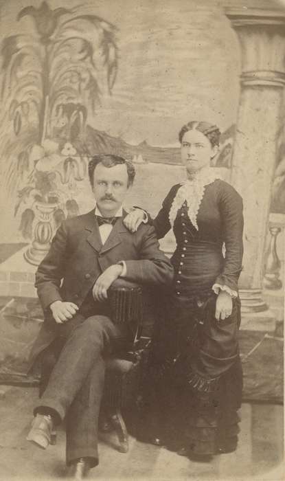 Portraits - Group, carte de visite, correct date needed, IA, Iowa, couple, woman, frock coat, Families, Olsson, Ann and Jons, history of Iowa, painted backdrop, lace collar, man, mustache, bow tie, Iowa History