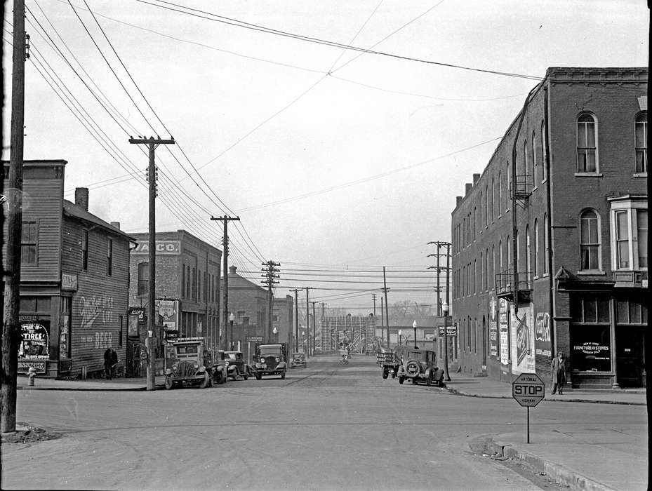 telephone pole, Main Streets & Town Squares, stop sign, fire escape, Iowa History, Ottumwa, IA, history of Iowa, Lemberger, LeAnn, storefront, Motorized Vehicles, Businesses and Factories, car, Iowa, Cities and Towns, fire hydrant