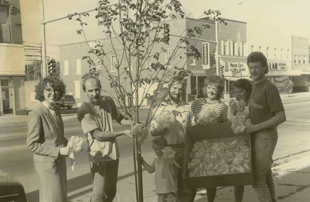 Portraits - Group, history of Iowa, Iowa History, general store, bow, storefront, ribbon, Civic Engagement, brick building, organization, child, woman, Waverly, IA, man, Iowa, tree, street, Waverly Public Library