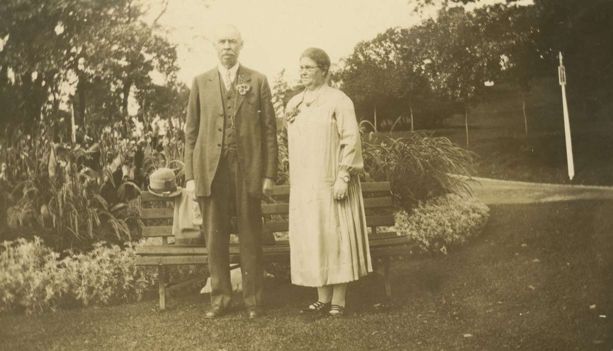 Outdoor Recreation, boutonniere, flowers, bench, Quad Cities, IA, history of Iowa, Iowa History, park, Portraits - Group, Weddings, Iowa, vest, suit, flowerbed, Aust, Kim, dress, garden, corsage, park bench