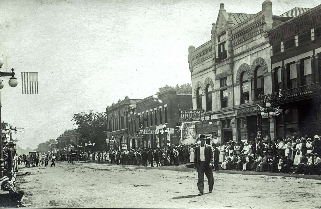 Iowa, parade, storefront, bowler hat, Fairs and Festivals, Entertainment, Anamosa, IA, Anamosa Library & Learning Center, drugstore, history of Iowa, flag, Main Streets & Town Squares, Iowa History