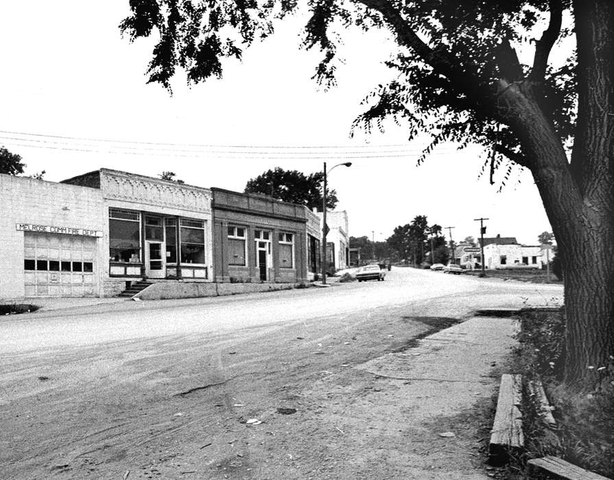 Main Streets & Town Squares, fire department, history of Iowa, Iowa History, Lemberger, LeAnn, storefront, Motorized Vehicles, Businesses and Factories, store, car, Melrose, IA, dirt road, street light, Iowa, Cities and Towns, bank