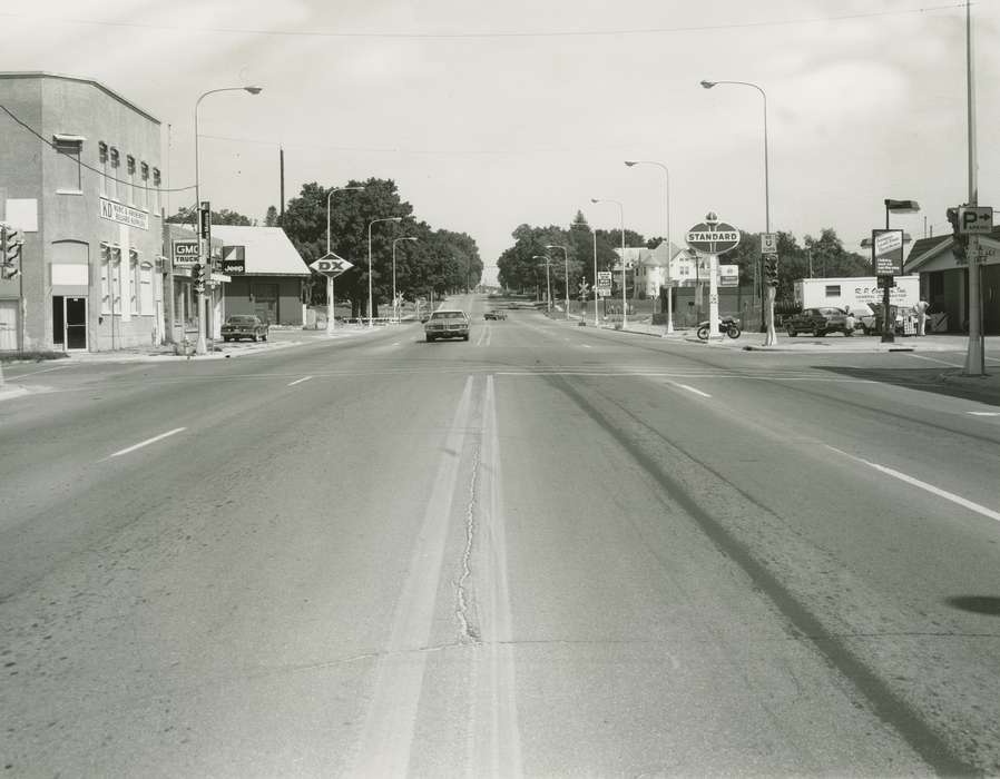 Main Streets & Town Squares, Waverly Public Library, history of Iowa, Iowa History, automobile, Motorized Vehicles, Businesses and Factories, street light, gas station, Iowa, Cities and Towns, tires, correct date needed, gas pump, railroad crossing