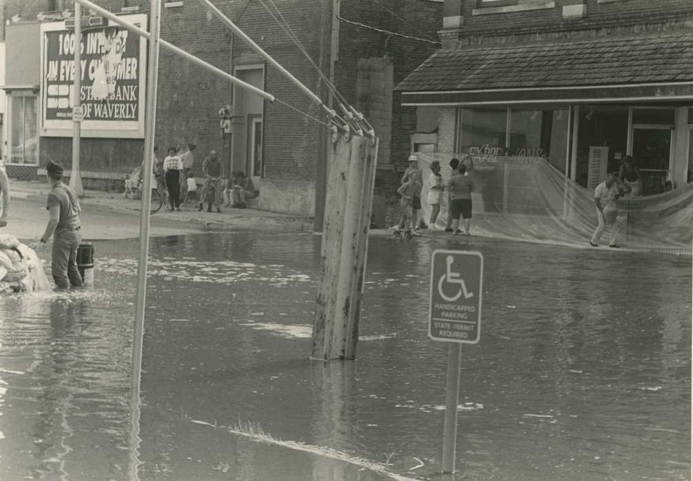 Floods, history of Iowa, Iowa History, Motorized Vehicles, Businesses and Factories, Civic Engagement, bicycle, Waverly, IA, tarp, Iowa, Cities and Towns, sandbagging, power lines, sandbag, Waverly Public Library