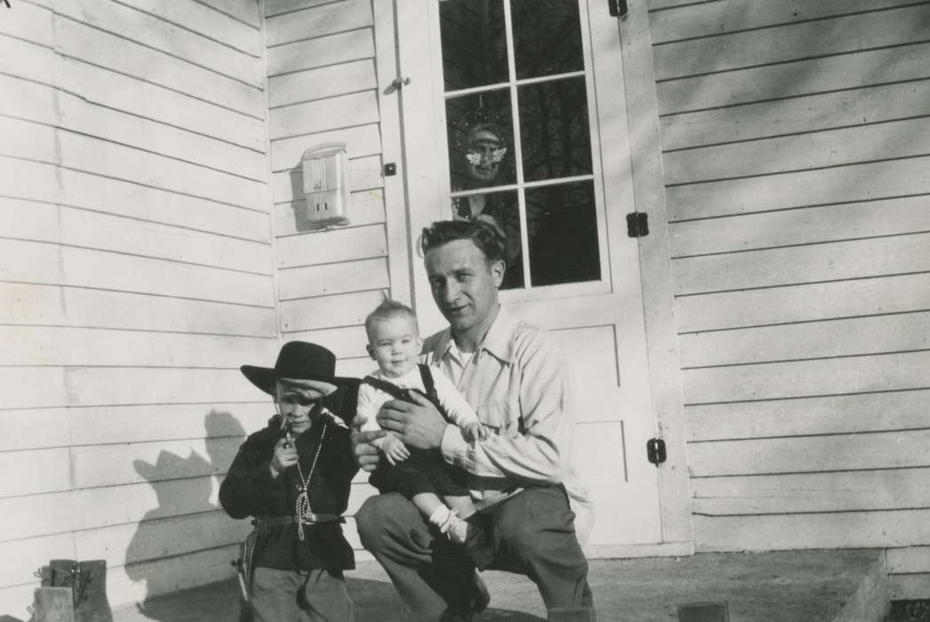 cowboy costume, baby, father, Suarez, Christine, Homes, history of Iowa, Spirit Lake, IA, Iowa, Families, Iowa History, Children, stoop, Portraits - Group