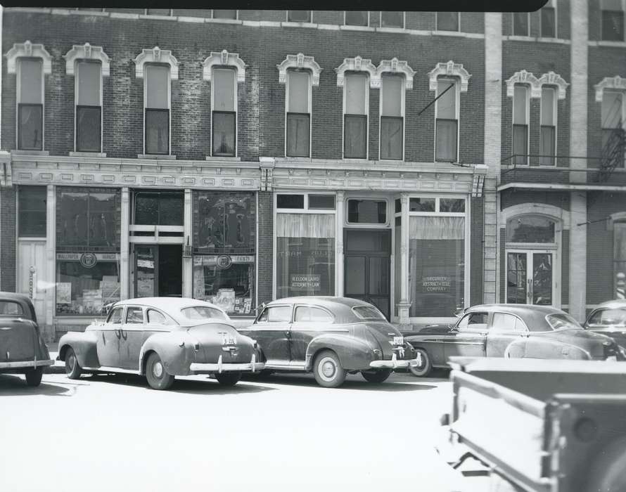 license plate, Main Streets & Town Squares, history of Iowa, Iowa History, storefront, Motorized Vehicles, window, brick building, car, window display, Waverly, IA, Iowa, correct date needed, Cities and Towns, store front, sign, Waverly Public Library