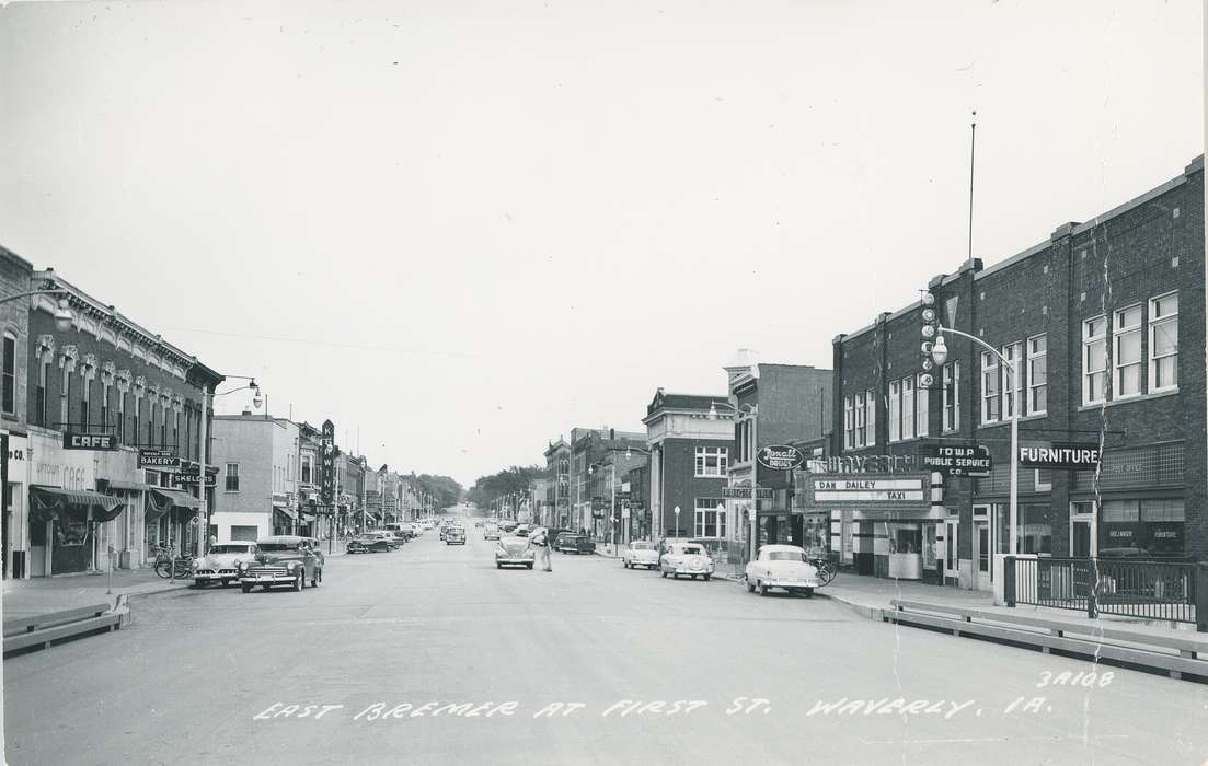 cars, Businesses and Factories, cafe, Cities and Towns, government building, studebaker, Waverly Public Library, mainstreet, Main Streets & Town Squares, post office, shoe store, Iowa History, history of Iowa, dodge, bakery, Motorized Vehicles, ford, brick building, Waverly, IA, movie theater, Iowa, drugstore, rambler