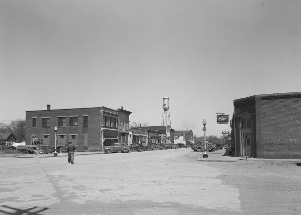 mainstreet, Main Streets & Town Squares, Ackerman, Bill, history of Iowa, Iowa History, Motorized Vehicles, Businesses and Factories, street parking, buildings, water tower, street corner, Iowa, Cities and Towns, lamppost