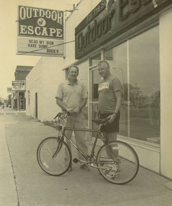 men, Waverly Public Library, Iowa History, Waverly, IA, storefront, Portraits - Group, Businesses and Factories, history of Iowa, Iowa, bicycle, Main Streets & Town Squares