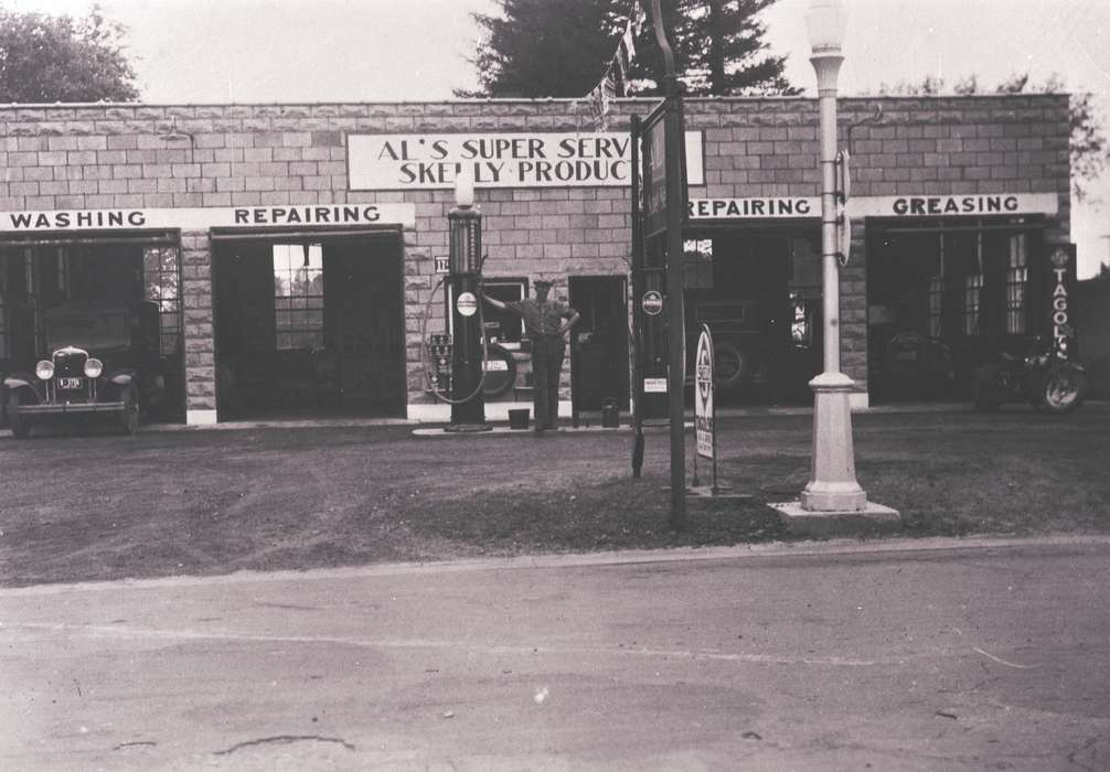 Waverly, IA, history of Iowa, Motorized Vehicles, Iowa, Cities and Towns, car, sign, correct date needed, Businesses and Factories, Portraits - Individual, Waverly Public Library, motorcycle, Iowa History, road