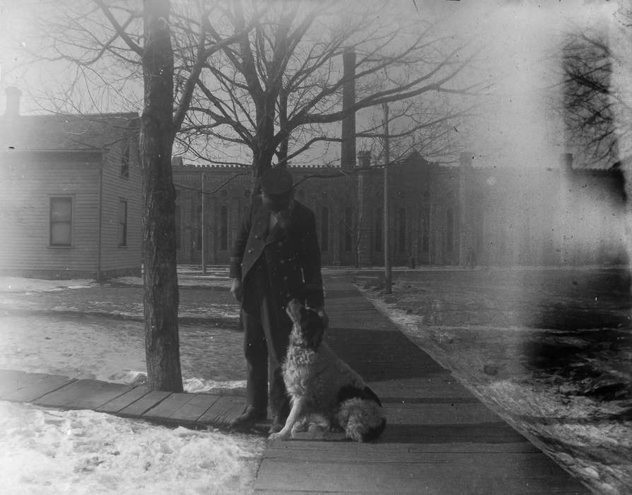 IA, Iowa, Animals, Iowa History, dog, sidewalk, history of Iowa, Businesses and Factories, Anamosa Library & Learning Center, tree, snow, suit, Labor and Occupations