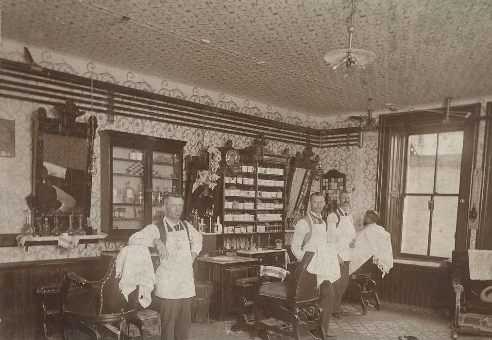 barber, mirror, light fixture, Businesses and Factories, hair, Cities and Towns, mustache, apron, cabinet, Waverly Public Library, filigree, history of Iowa, barber chair, Iowa History, beard, pipes, sink, Iowa, tonic, salon, Labor and Occupations
