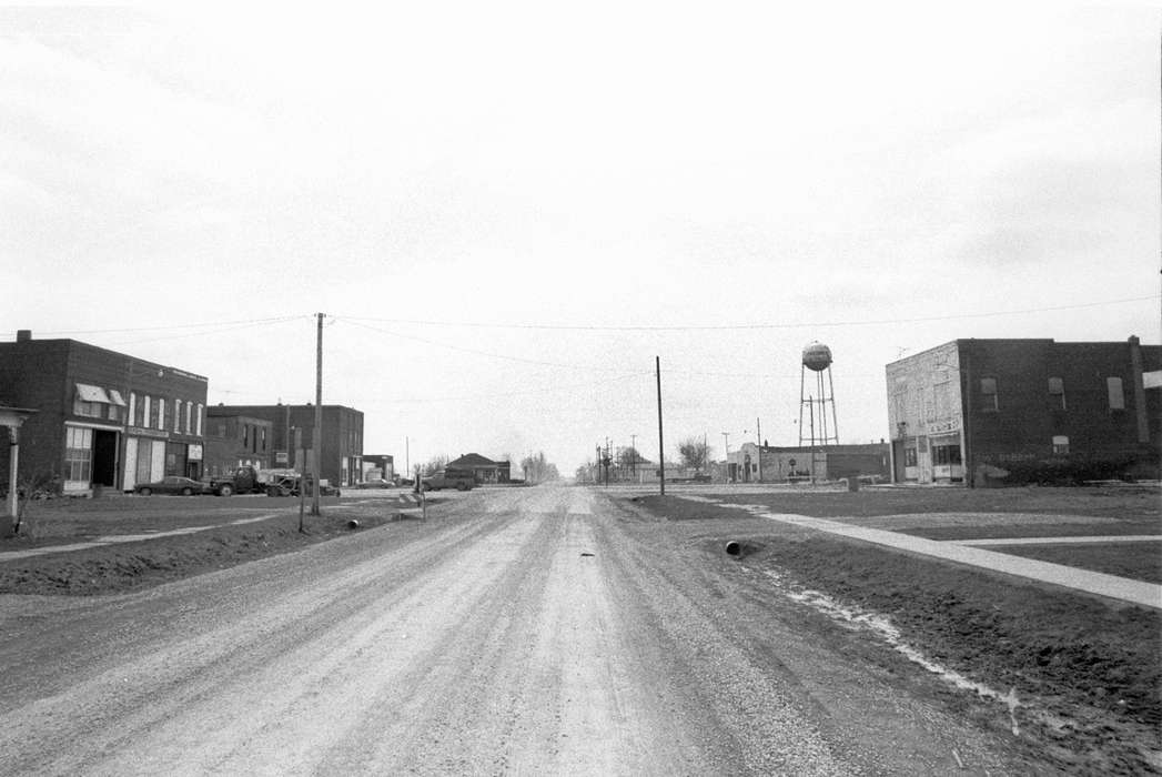 Businesses and Factories, storefront, Cities and Towns, dirt road, Iowa, Iowa History, Lemberger, LeAnn, Cincinnati, IA, truck, water tower, Main Streets & Town Squares, ditch, history of Iowa