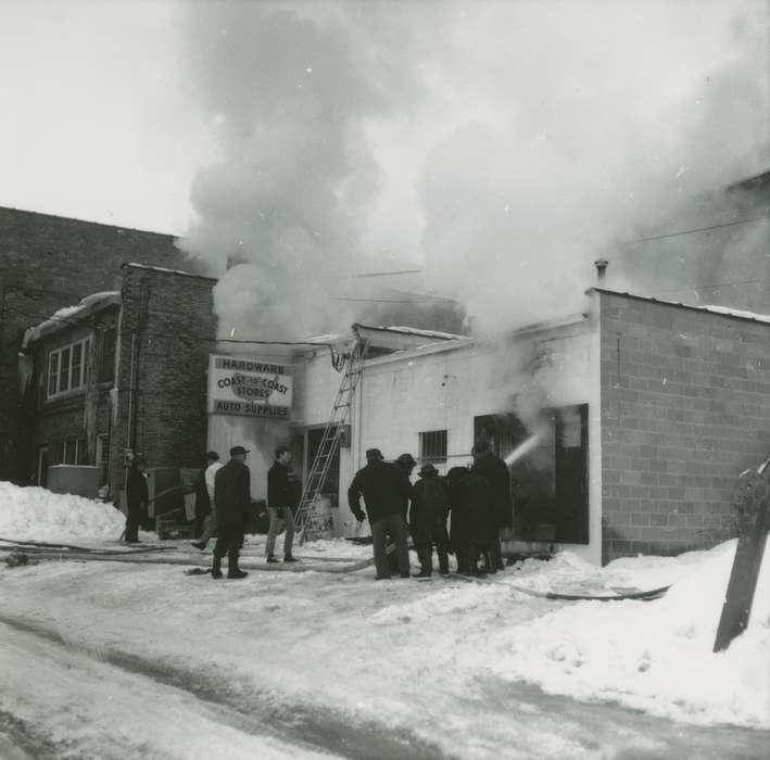 hose, sign, history of Iowa, fireman, hardware store, Businesses and Factories, Waverly Public Library, Iowa, firefighter, ladder, smoke, Winter, Iowa History, Cities and Towns, Labor and Occupations, Wrecks