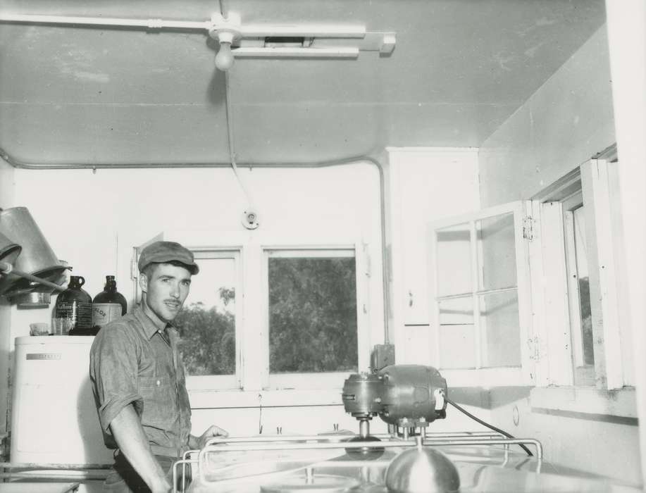 Portraits - Individual, history of Iowa, window, man, Businesses and Factories, Waverly Public Library, Iowa, bucket, light fixture, machinery, moustache, baseball cap, Iowa History, jug, lightbulb, worker, Labor and Occupations