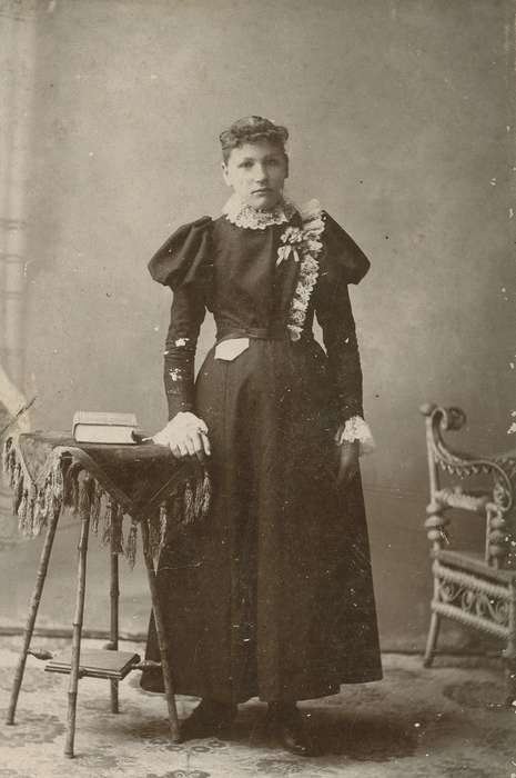 fringe, handkerchief, Iowa, table, woman, lace, Olsson, Ann and Jons, Portraits - Individual, book, tablecloth, Cedar Falls, IA, painted backdrop, lace collar, history of Iowa, cabinet photo, wicker chair, Iowa History