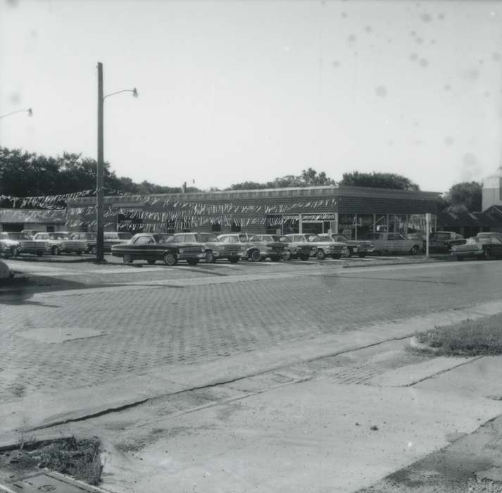 history of Iowa, cars, Iowa History, brick street, Iowa, Cities and Towns, car dealership, Waverly Public Library