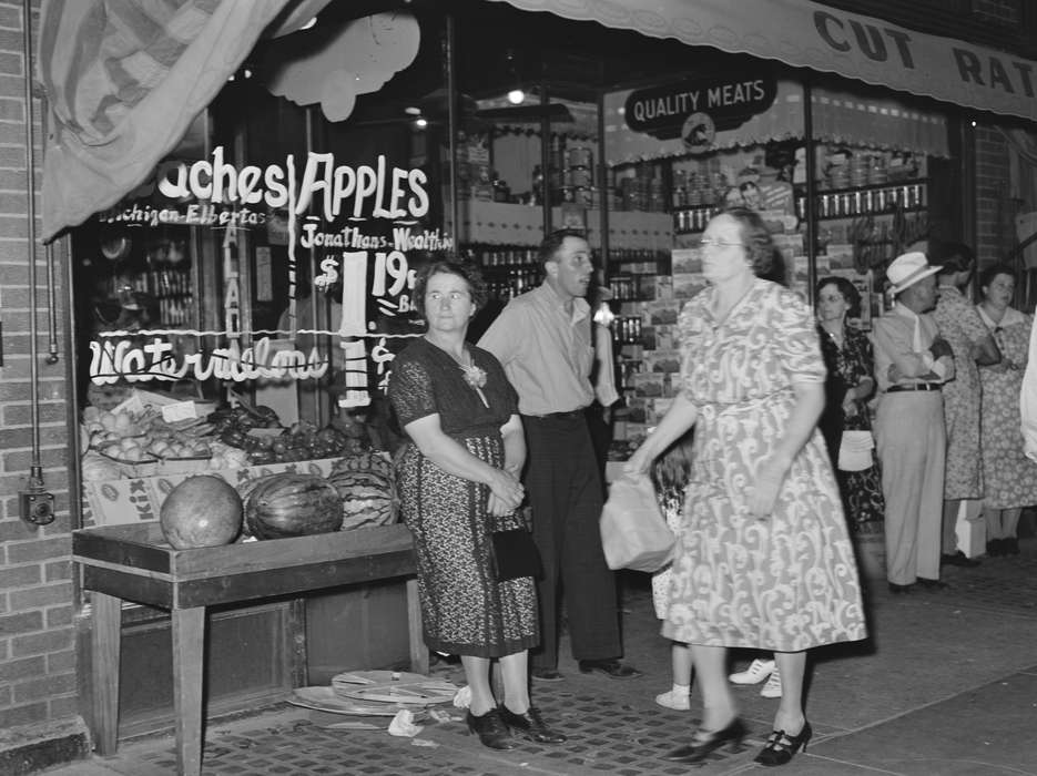 mainstreet, history of Iowa, window display, Library of Congress, storefront, Main Streets & Town Squares, Iowa, Food and Meals, Cities and Towns, Families, mingling, Businesses and Factories, Iowa History, Leisure, general store